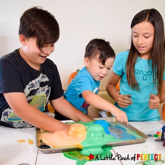 Kids doing Witches Brew Science Experiment